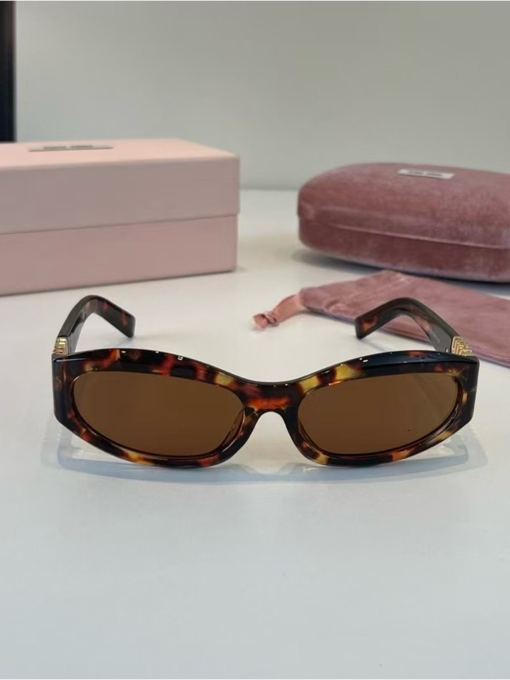 Miu Miu Tortoiseshell Oval Women's Sunglasses - Brown Lenses